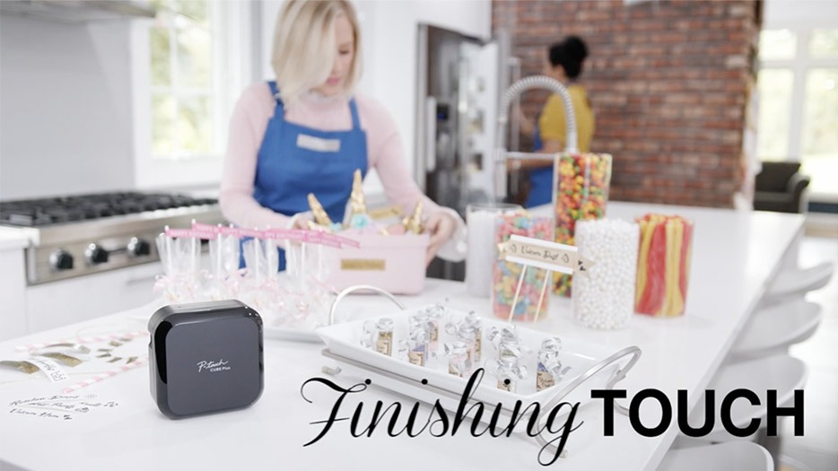 A female actress in her kitchen label party supplies for a commercial video marketing production