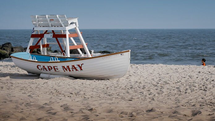 NJ Video Marketing Agency case study on a commercial shoot in cape may NJ with a boat on a beach
