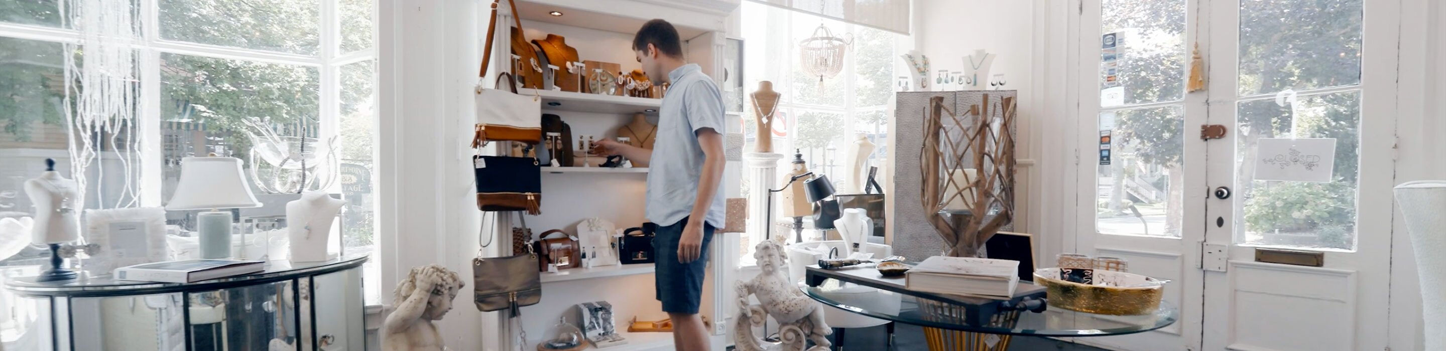 An actor browses in a beach side store for a NJ Video Marketing Agency commercial shoot