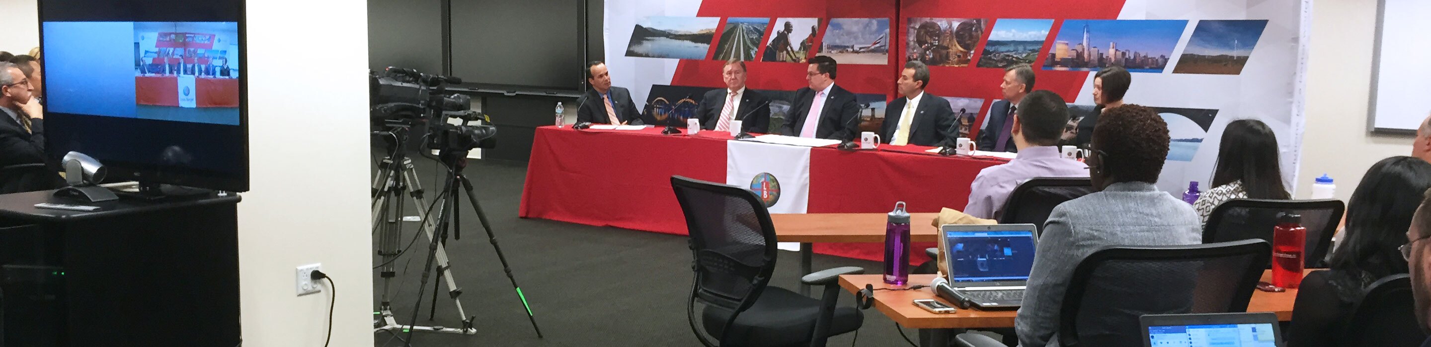 The exective team of a large corporation is filmed during a corporate video livestream