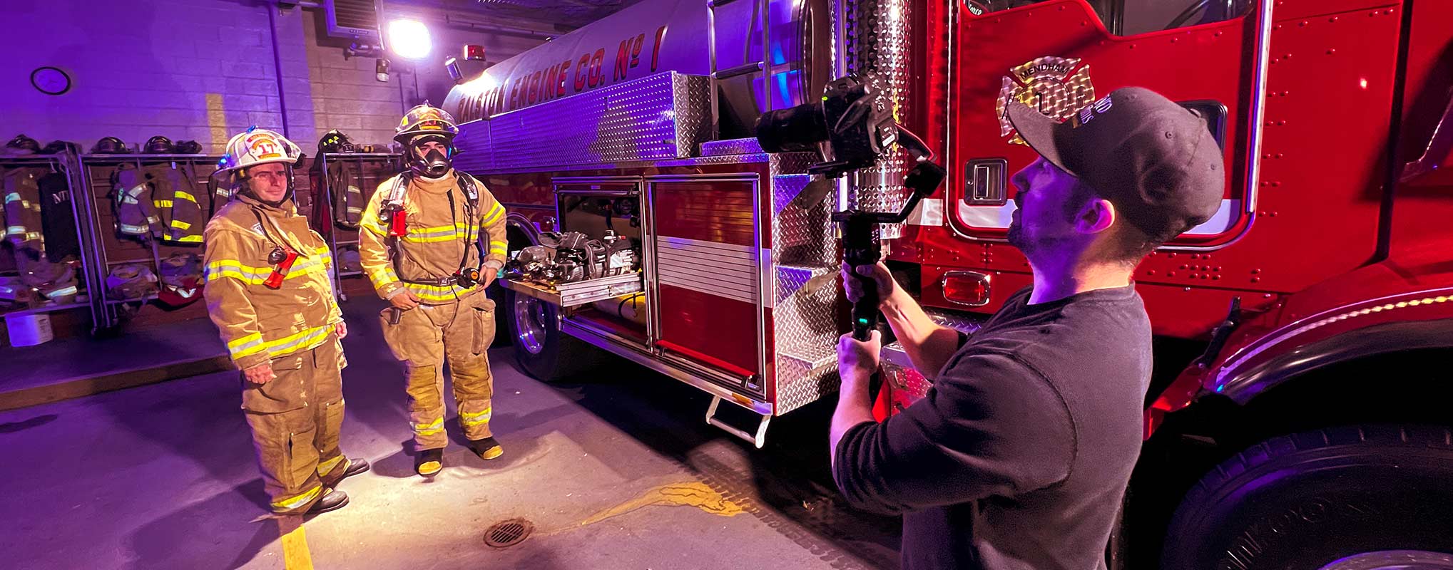 A Filmmaker at Awakened Films uses a gimbal camera while filming a scene with firemen in New Jersey
