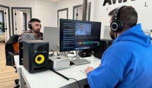 A team of video editors in NJ working on Adobe creative suite software