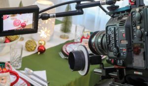 A camera focuses on a holiday scene for a commercial filmed by a video production services company
