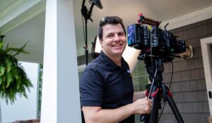 A nj cinematographer smiles as he frames the shot for a video marketing production