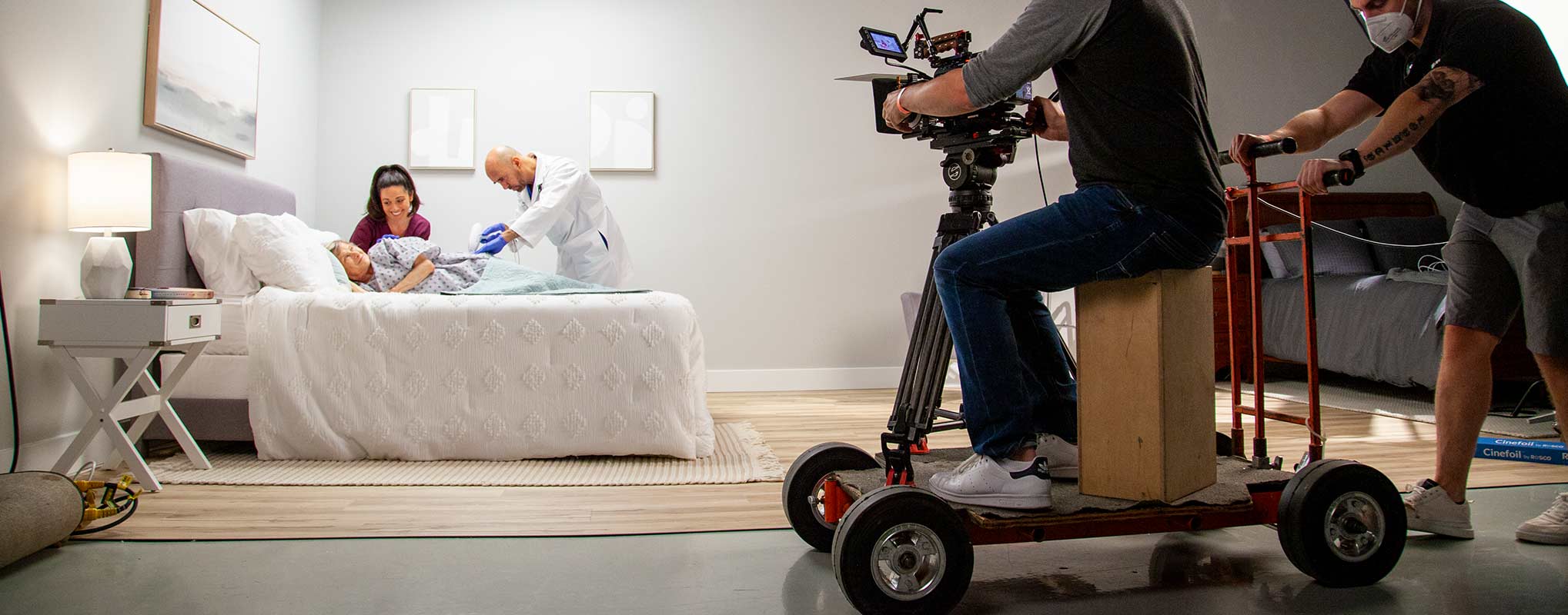 A camera dollys in towards actors for a nj video marketing studio studio