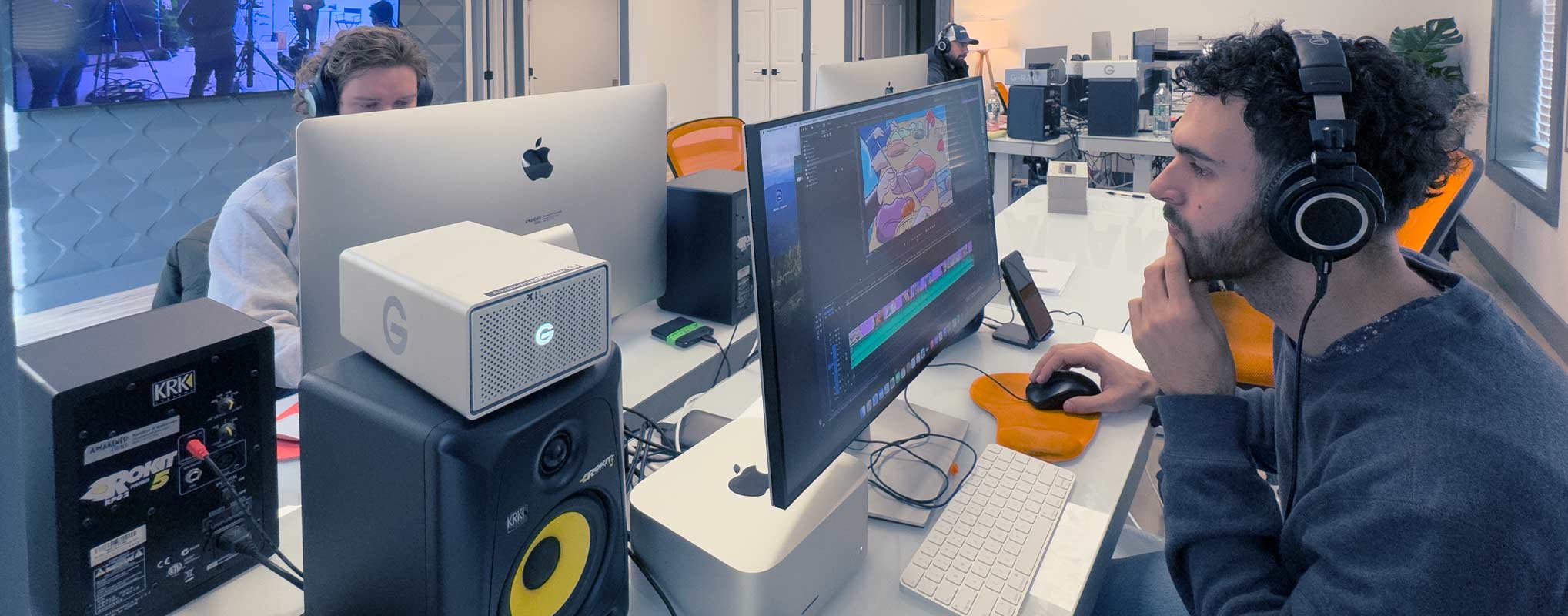 A NJ video marketer works on an Apple Computer