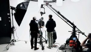 Three crew members work on a marketing video