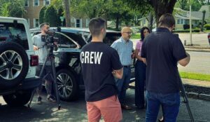 crew setup a shot with actors in a parking lot, to learn why video marketing is important.