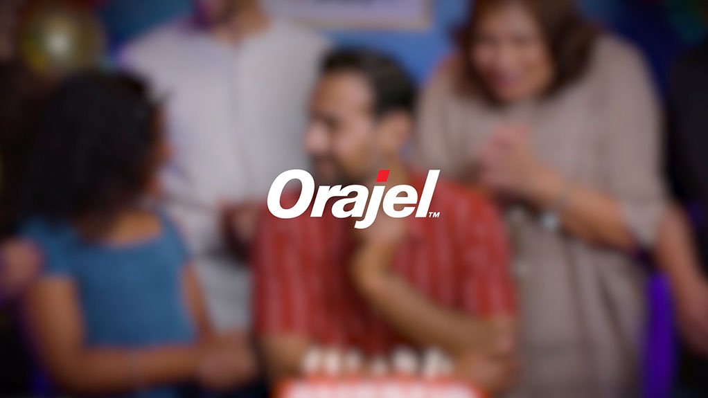 A family celebrates in video commercial shoot for orajel