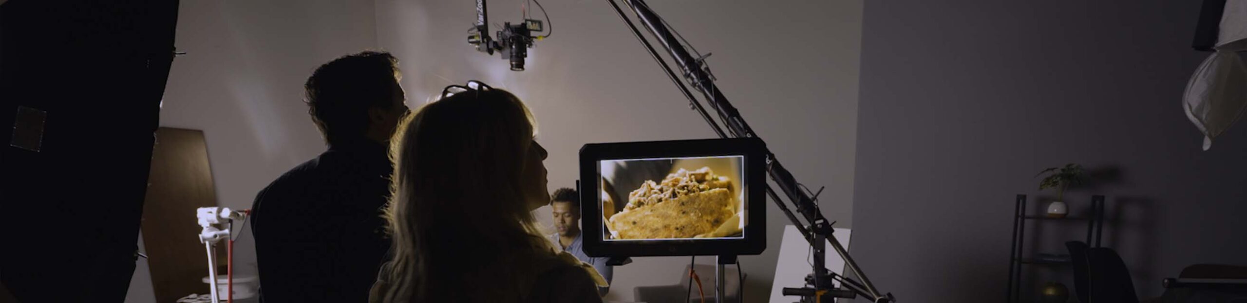 A client looks at a monitor during a video production with awakened films in Madison, New Jersey