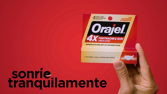 hand holding up medicine in orajel video commercial filmed in NJ