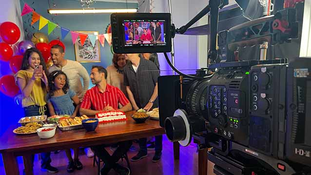Behind the scenes of a camera filming a social media video with orajel