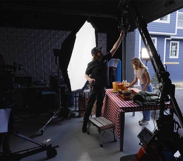 An actress poses for a food commercial in a New Jersey video marketing studio