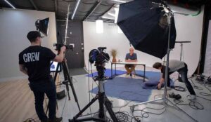 A studio is set to film content for a New Jersey Social Media Plans. A local nj business owner talks on camera for his social media channels.