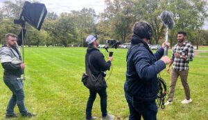A NJ social media agency films a business owner to create social media content