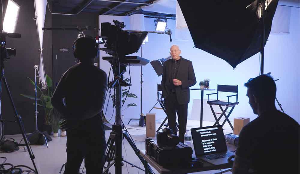 A movie producer is filmed at Awakened Films' NJ Production Studio