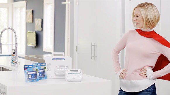 a young female actress with a cape posing next to a container store product is filmed for a NJ commercial