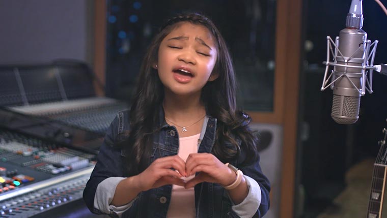 A young girkl sings in a studio for a NJ Nonprofit Video Production Services