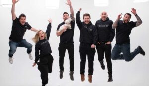 A New Jersey video production crew jumps with joy