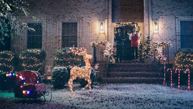 Exterior scene of a home with Christmas decorations is filmed for NJ Video Production Services