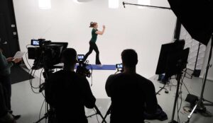 A New Jersey director works with a camera crew on a studio shoot