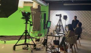 Clients talk during a film shoot at a New Jersey Corporate Production Studio