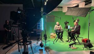 A corporate video is bring filmed on a greenscreen in a NJ studio