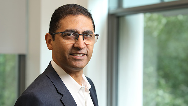 an executive poses for a headshot in a medical video