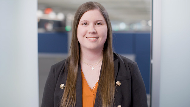 a young lab worker smiles on camera for a healthcarea video production