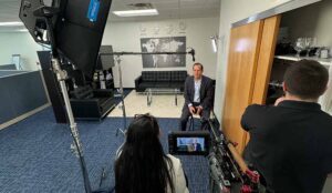 Man prepares for interview in corporate video production