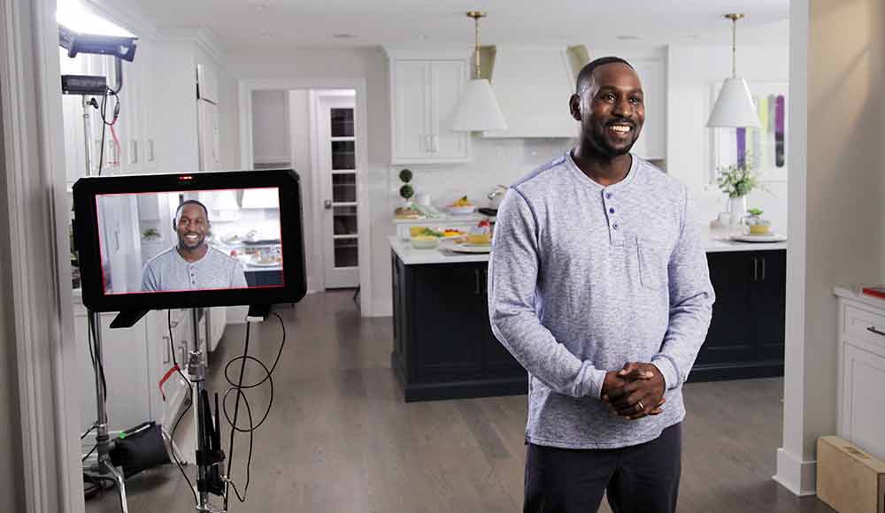 An african american actor poses for a TV commercial production with Awakened Films