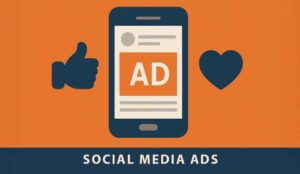 A blue and orange icon showing a social media types of advertisement with a moble phone, a heart and a thumbs up
