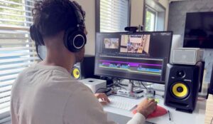An editor works on post-production at the studios at Awakened Films