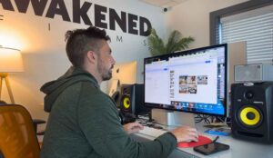 An employee at Awakend Films works on a Social Media Marketing Strategy for a NJ based client.