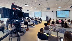 A client understands the ROI of event videographer pricing is filmed at her corporate event.