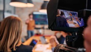 A videographer films corporate content for a brand video