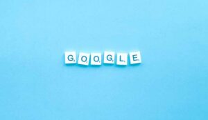 A blue image with white tiles spelling "GOOGLE"